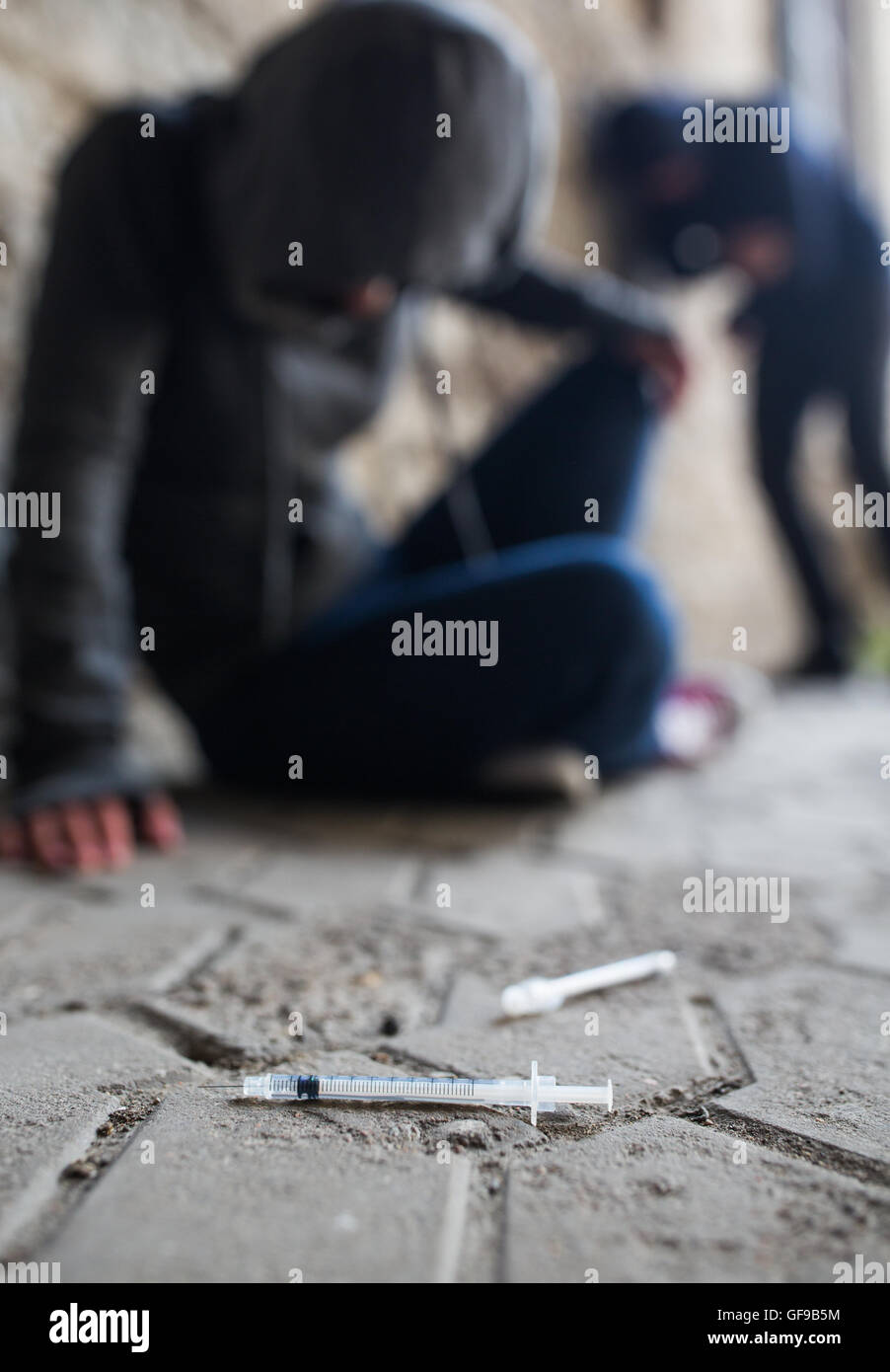 close up of addicts and drug syringes on ground Stock Photo Alamy