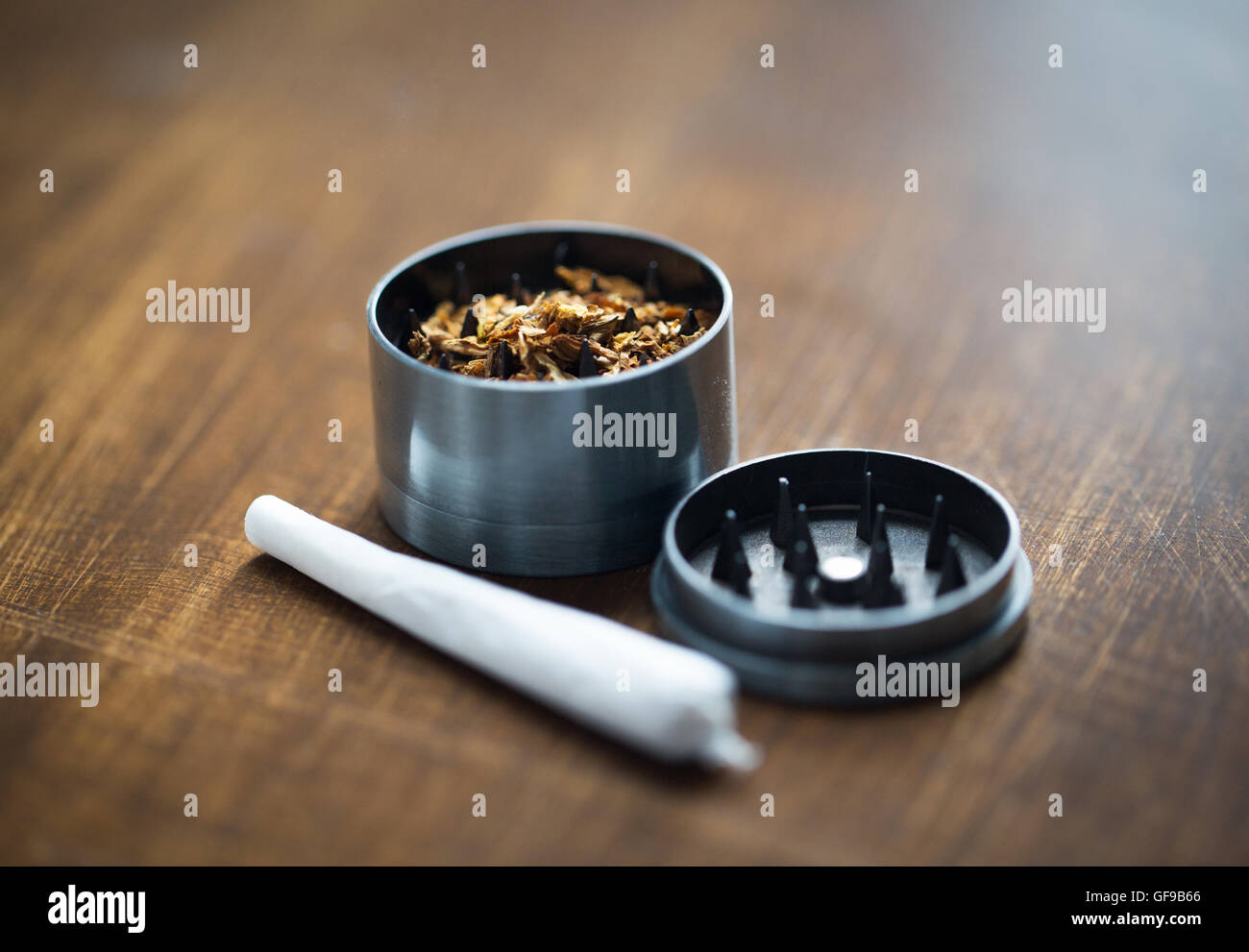 close up of marijuana joint and herb grinder Stock Photo Alamy