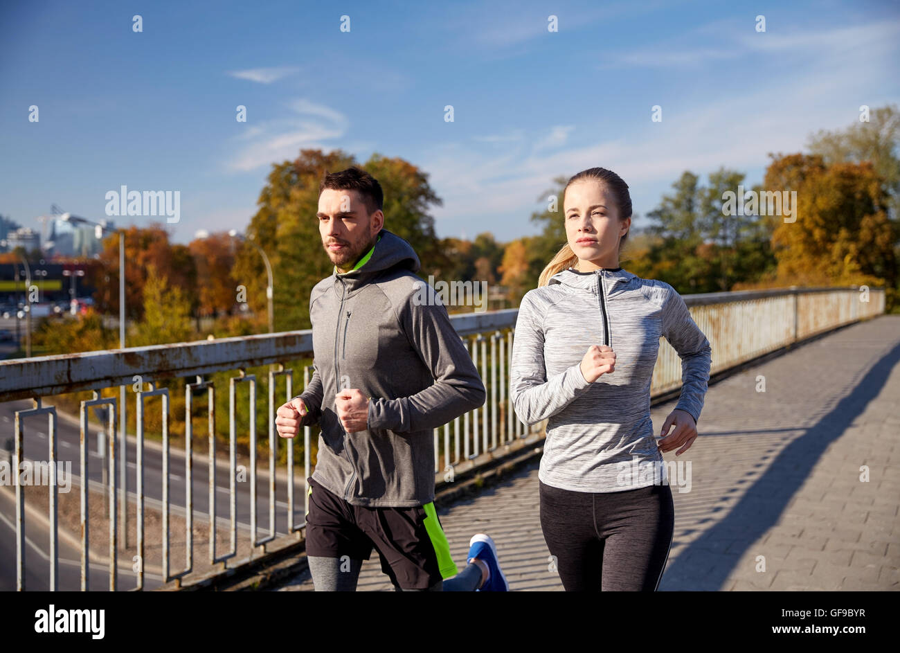 happy couple running outdoors Stock Photo - Alamy
