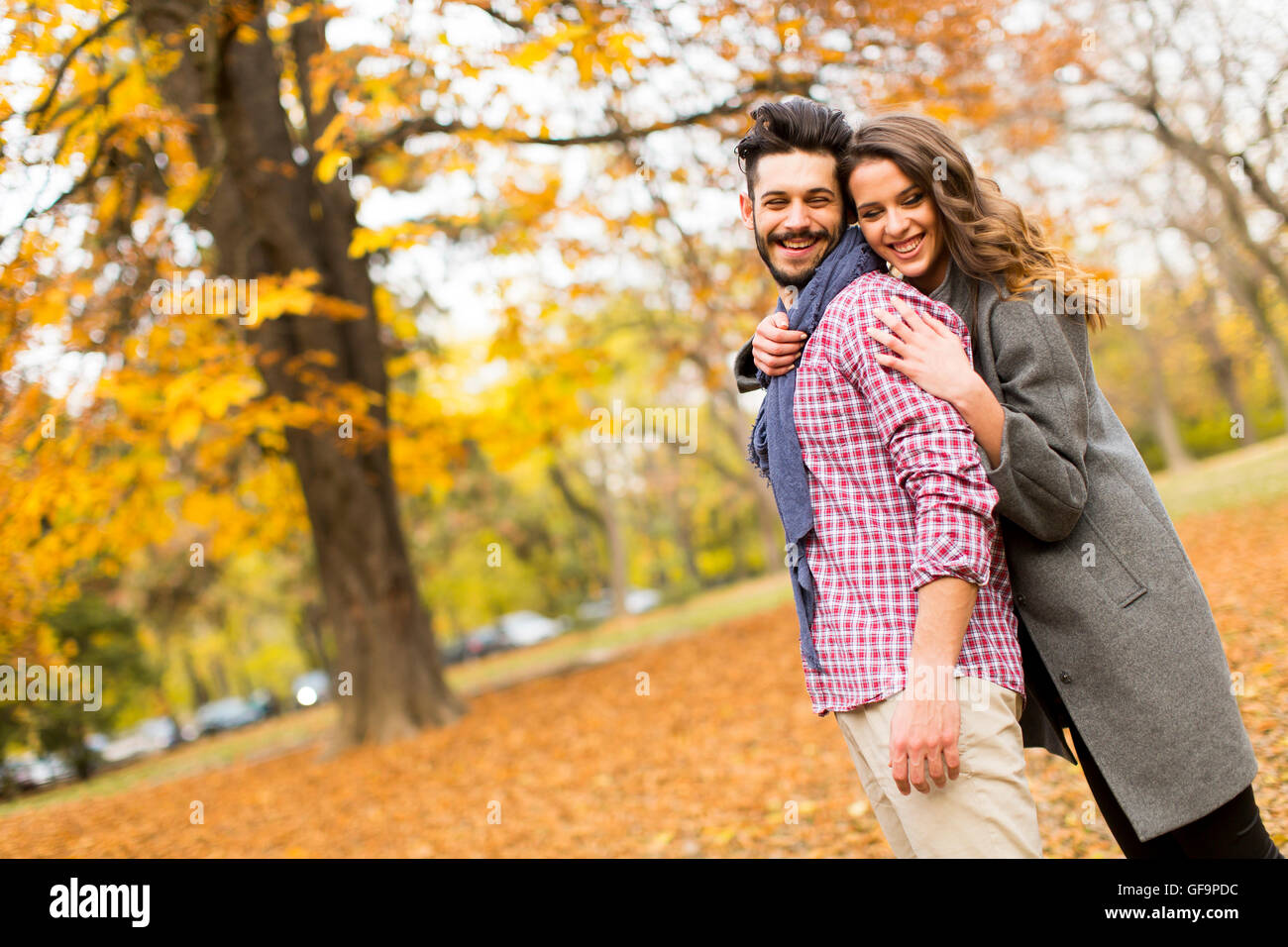 Loving young couple in the autumn park Stock Photo - Alamy