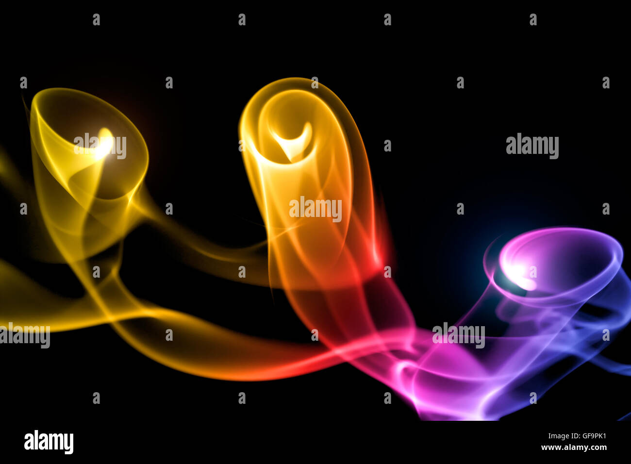 Smoke colorful on black background Stock Photo - Alamy