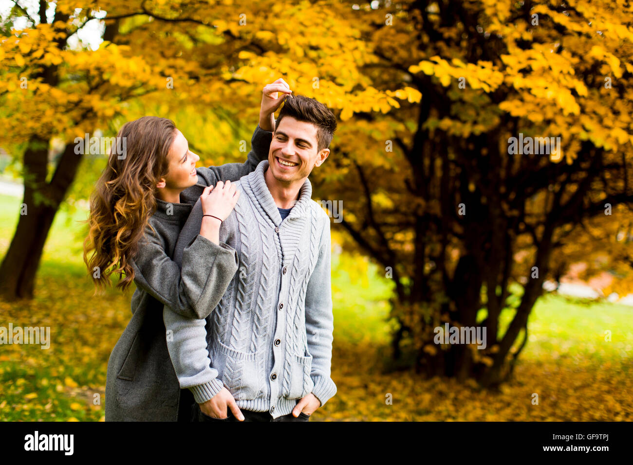 Loving young couple in the autumn park Stock Photo - Alamy