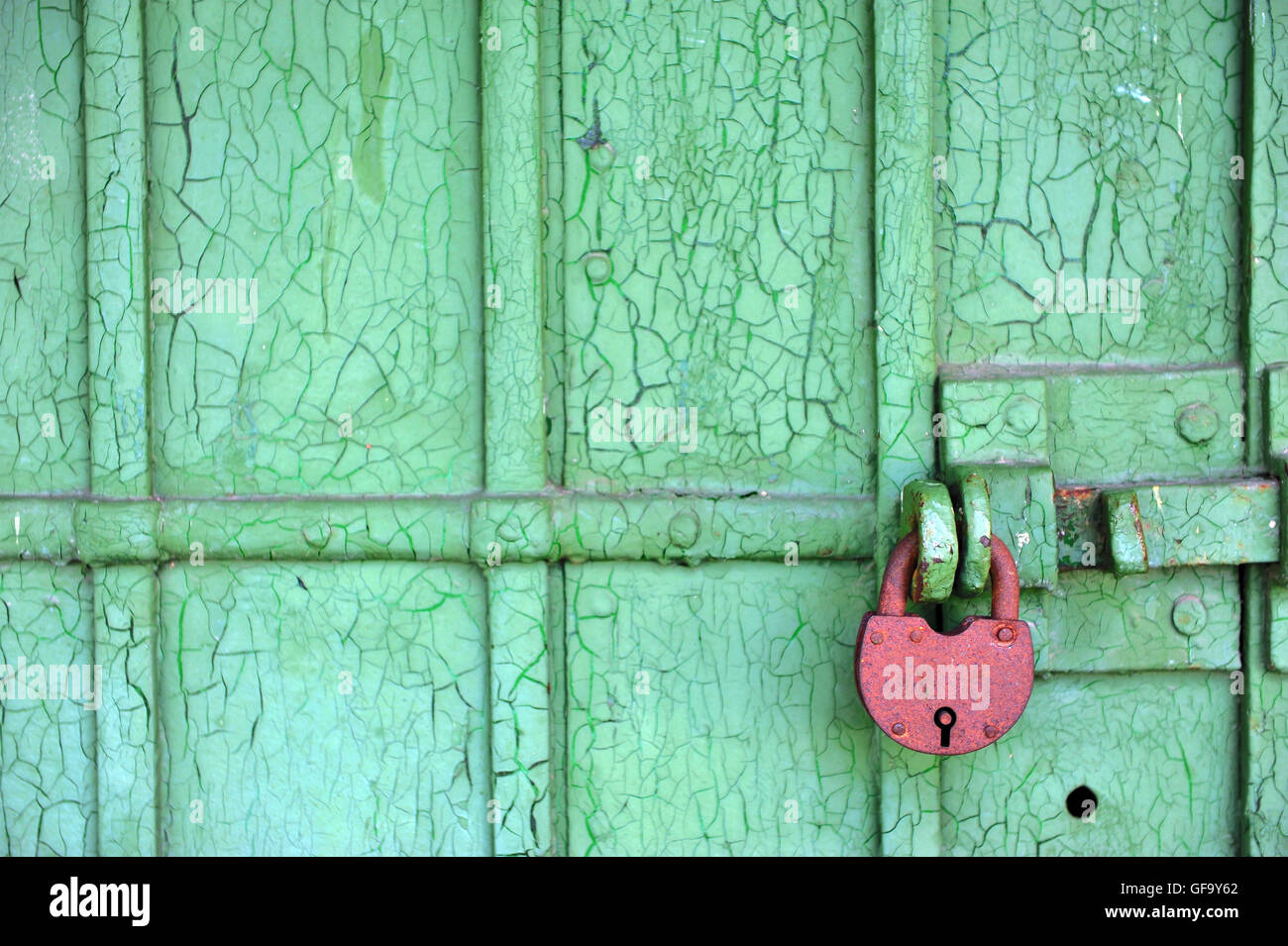 Iron lock on the old wooden door Stock Photo - Alamy