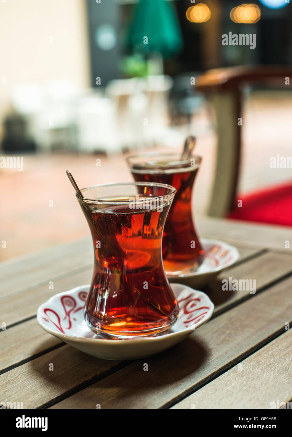 Turkish tea in traditional tulip glasses on table of street cafe Stock Photo