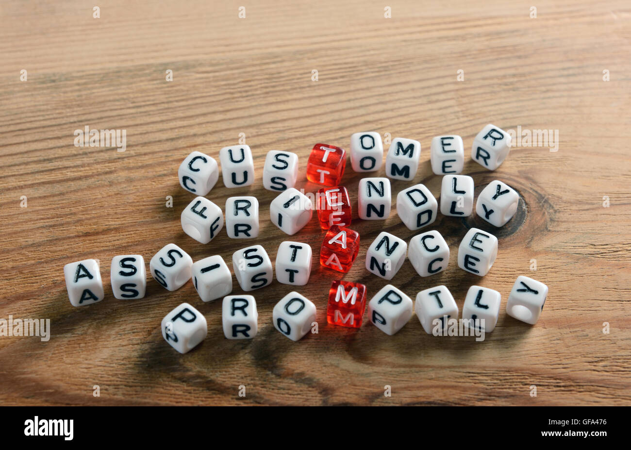 acronym of TEAM red and white  dices on wood Stock Photo
