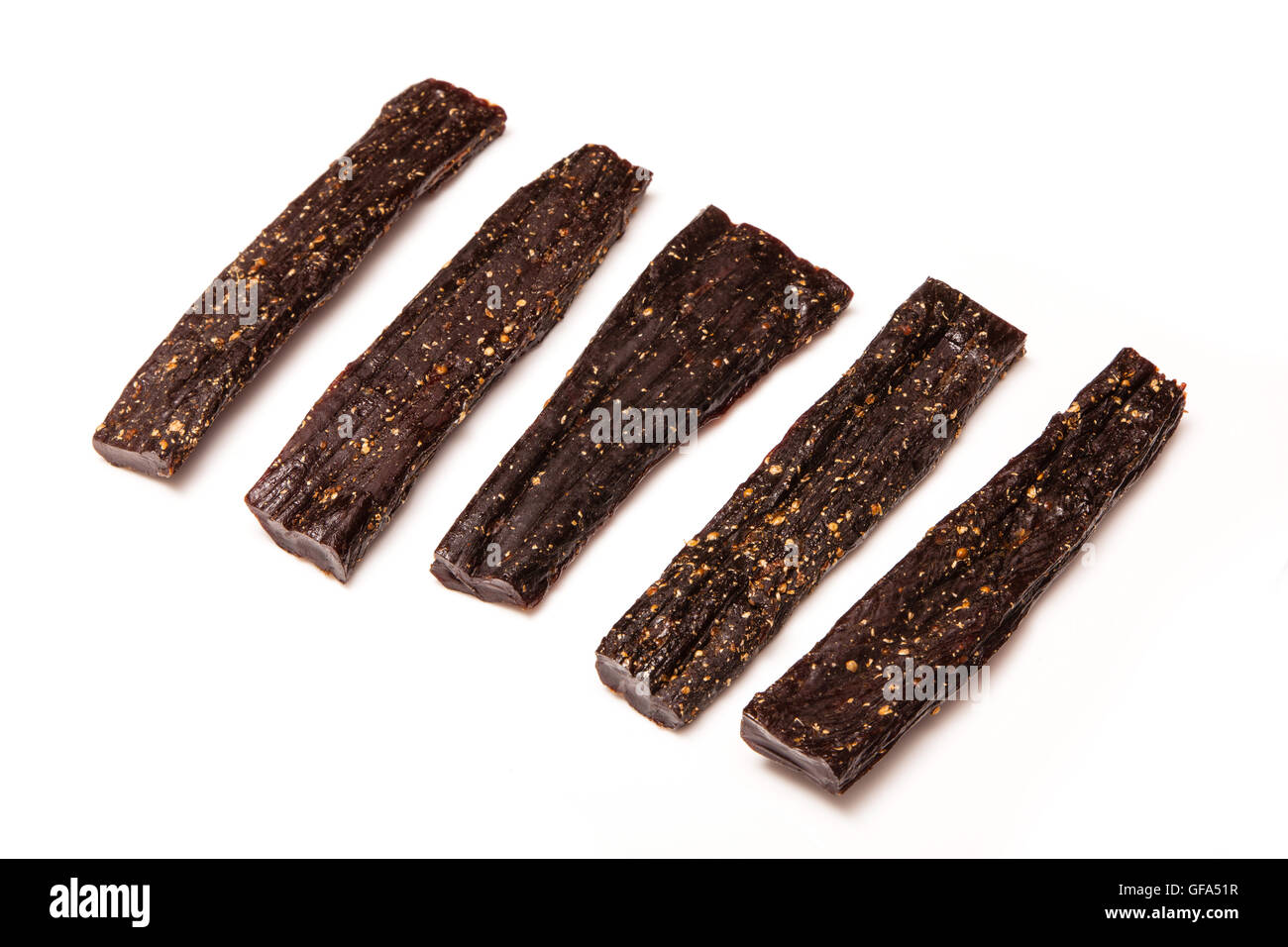 Beef Biltong sticks isolated on a white studio background. Stock Photo