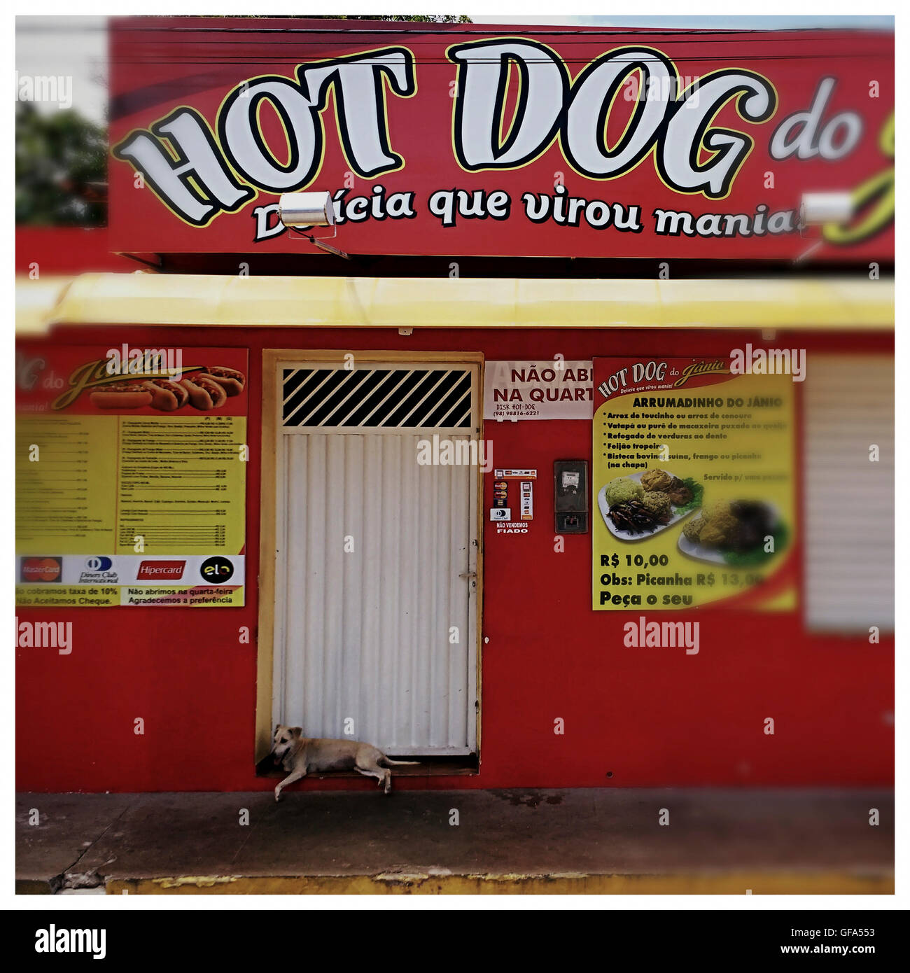Hot dog restaurant with a dog in front Stock Photo