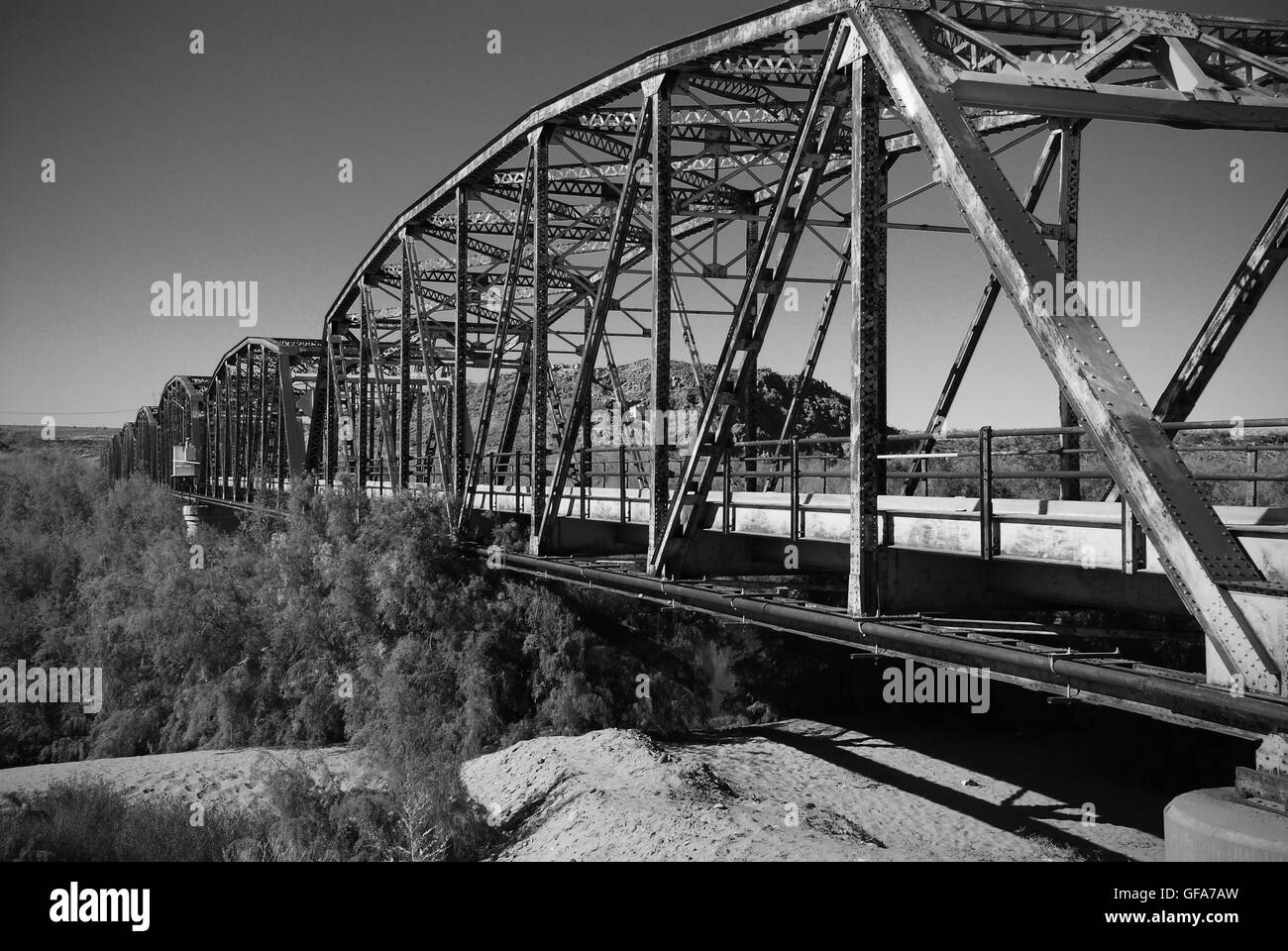 Rusty old steel bridge crossing river in southwest desert Stock Photo Alamy