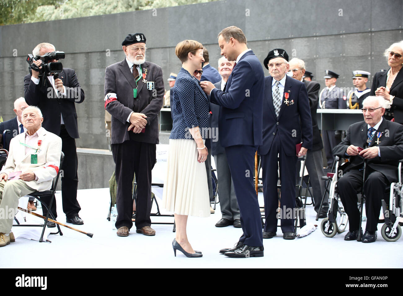 Warsaw, Poland. 30th July, 2016. President Andrzej Duda held speech at 72nd anniversary of the Warsaw rising of 1944 at the Warsaw Rising Museum. Participants of the rising of 1944 are honoured with state awards. Credit:  Jake Ratz/Alamy Live News Stock Photo
