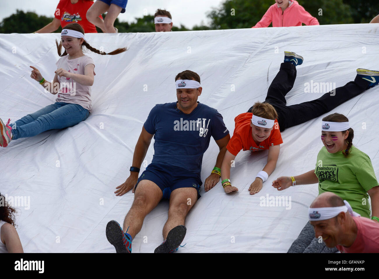 Carfest North, Bolesworth, Cheshire, UK. 30th July, 2016. Competitors on the Gung Ho Giant Inflatable obstacle course. The event is the brainchild of Chris Evans and features 3 days of cars, music and entertainment with profits being donated to the charity Children in Need. Credit:  Andrew Paterson/Alamy Live News Stock Photo