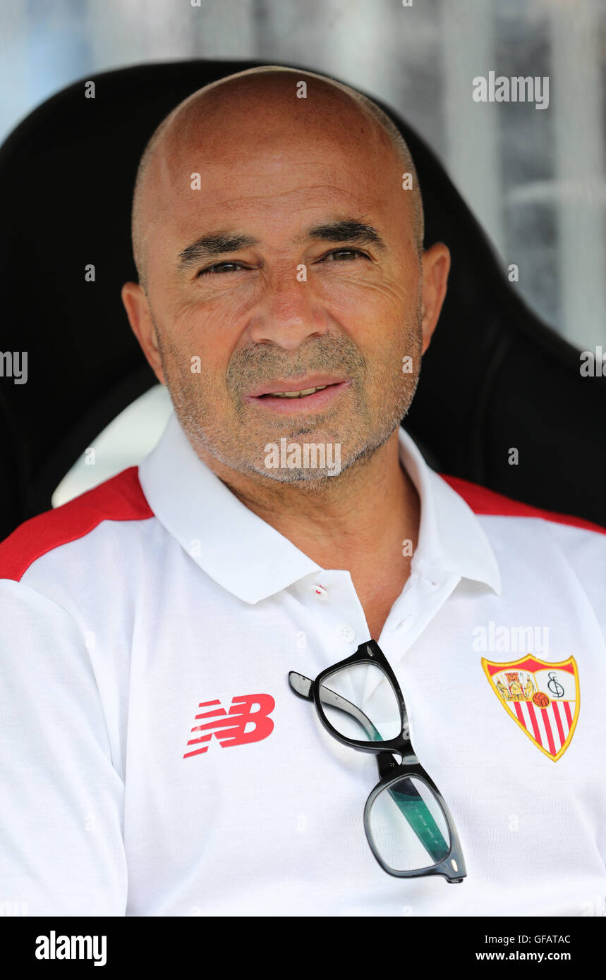 Hamburg, Germany. 30th July, 2016. Sevilla's coach Jorge Sampaoli sits on  the bench ahead of the soccer test match between FC St. Pauli and Sevilla  FC in the Millerntor-Stadion in Hamburg, Germany,