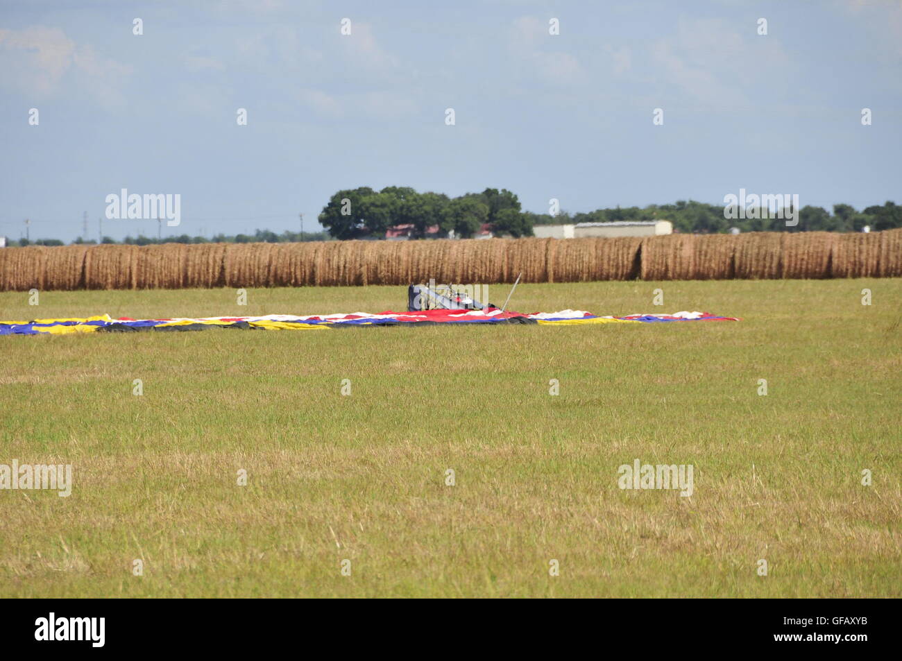 (160731) -- LOCKHART, July 31, 2016 (Xinhua) -- Debris of the balloon is seen at the site of a balloon crash accident near Lockhart, a city in the central part of the U.S. state of Texas, July 30, 2016. U.S. Texas Department of PUBLIC Safety has confirmed that 16 people were killed on Saturday morning after a hot air balloon caught on fire and crashed near Lockhart. The accident occurred shortly after 7:40 a.m. local time on Saturday near Lockhart, when the hot air balloon with at least 16 people on board crashed into a pasture, the Federal Aviation Administration (FAA) said in a statement on Stock Photo