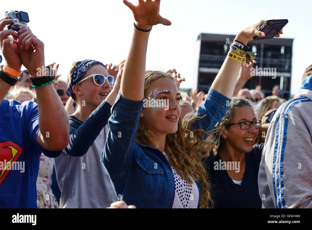Carfest North, Bolesworth, Cheshire, UK. 30th July 2016. People at the Main stage. The event is the brainchild of Chris Evans and features 3 days of cars, music and entertainment with profits being donated to the charity Children in Need. Andrew Paterson/Alamy Live News Stock Photo
