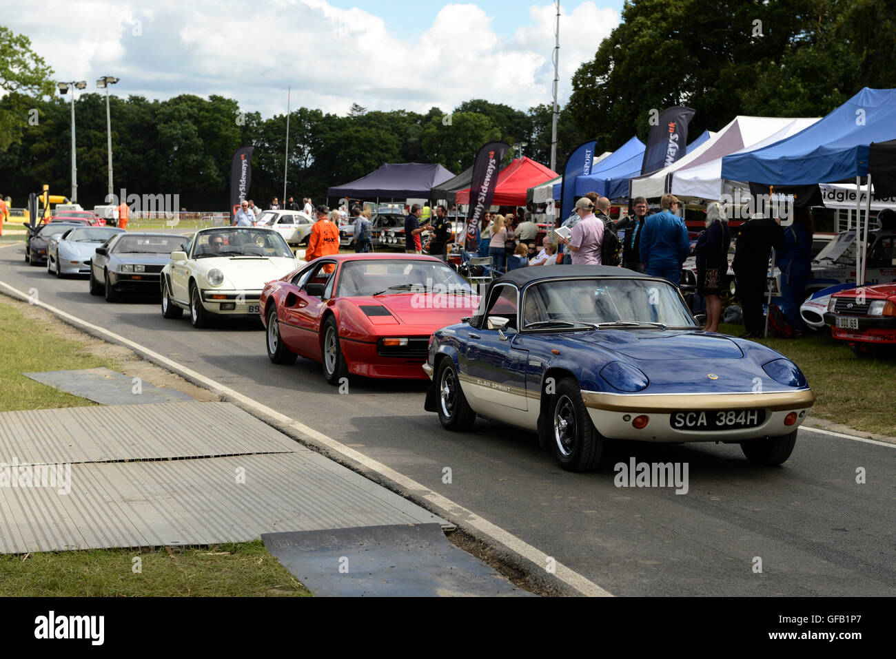 Carfest North, Bolesworth, Cheshire, UK. 31st July 2016. Cars line up to start a lap of the track being led by a Lotus Elan. The event is the brainchild of Chris Evans and features 3 days of cars, music and entertainment with profits being donated to the charity Children in Need. Andrew Paterson/Alamy Live News Stock Photo