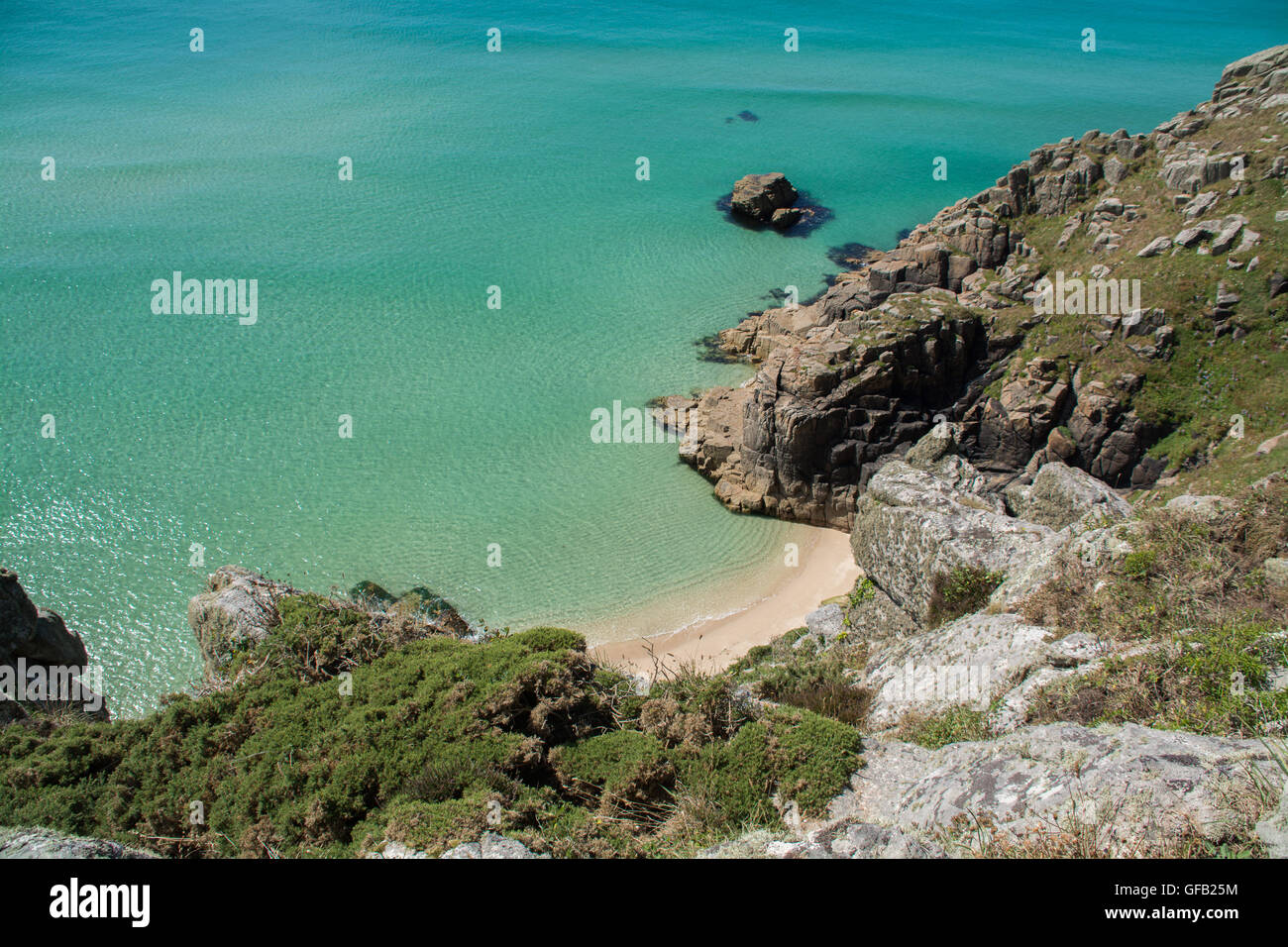 Porthcurno, Cornwall, UK. 31st July 2016. UK Weather. Turqoise blue seas and sunny clear skies for visitors to the beaches at Porthcurno and Treen. Credit:  cwallpix/Alamy Live News Stock Photo