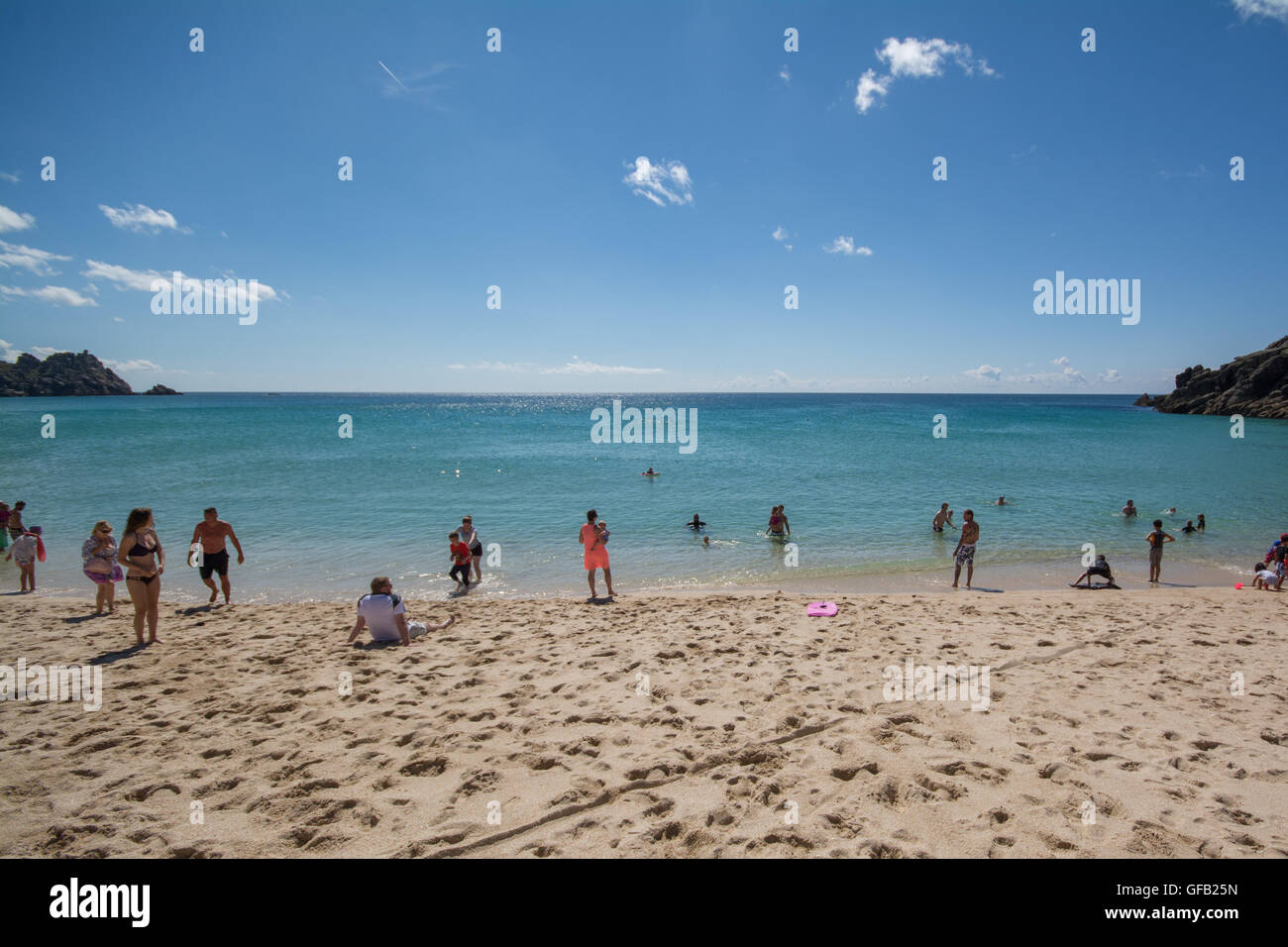 Porthcurno, Cornwall, UK. 31st July 2016. UK Weather. Turqoise blue seas and sunny clear skies for visitors to the beaches at Porthcurno and Treen. Credit:  cwallpix/Alamy Live News Stock Photo