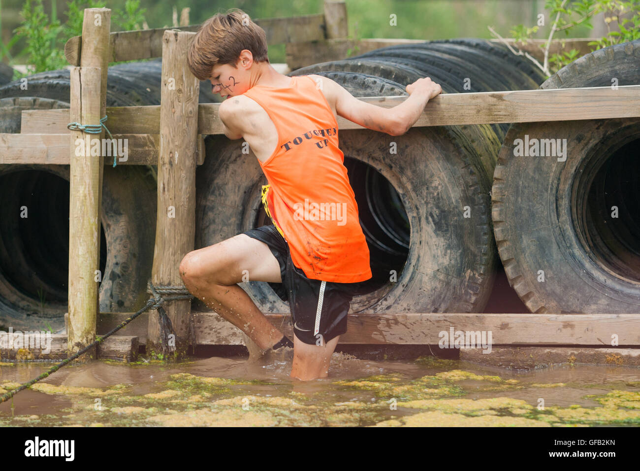 Tough Guy Nettle Warrior 2016 competitor, near Wolverhampton UK at the annual summer obstacle course Stock Photo