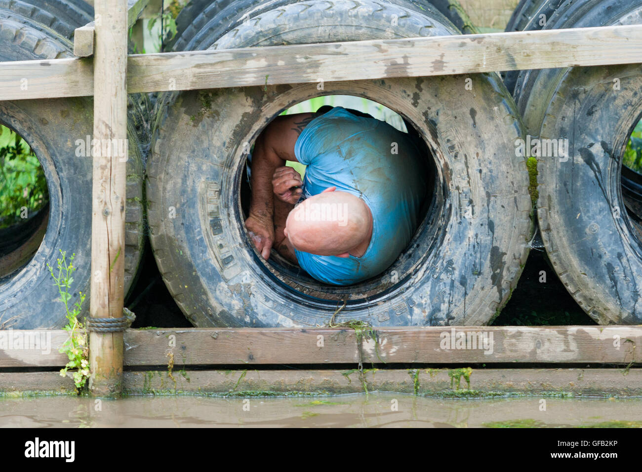 Tough Guy Nettle Warrior 2016 competitor, near Wolverhampton UK at the annual summer obstacle course Stock Photo