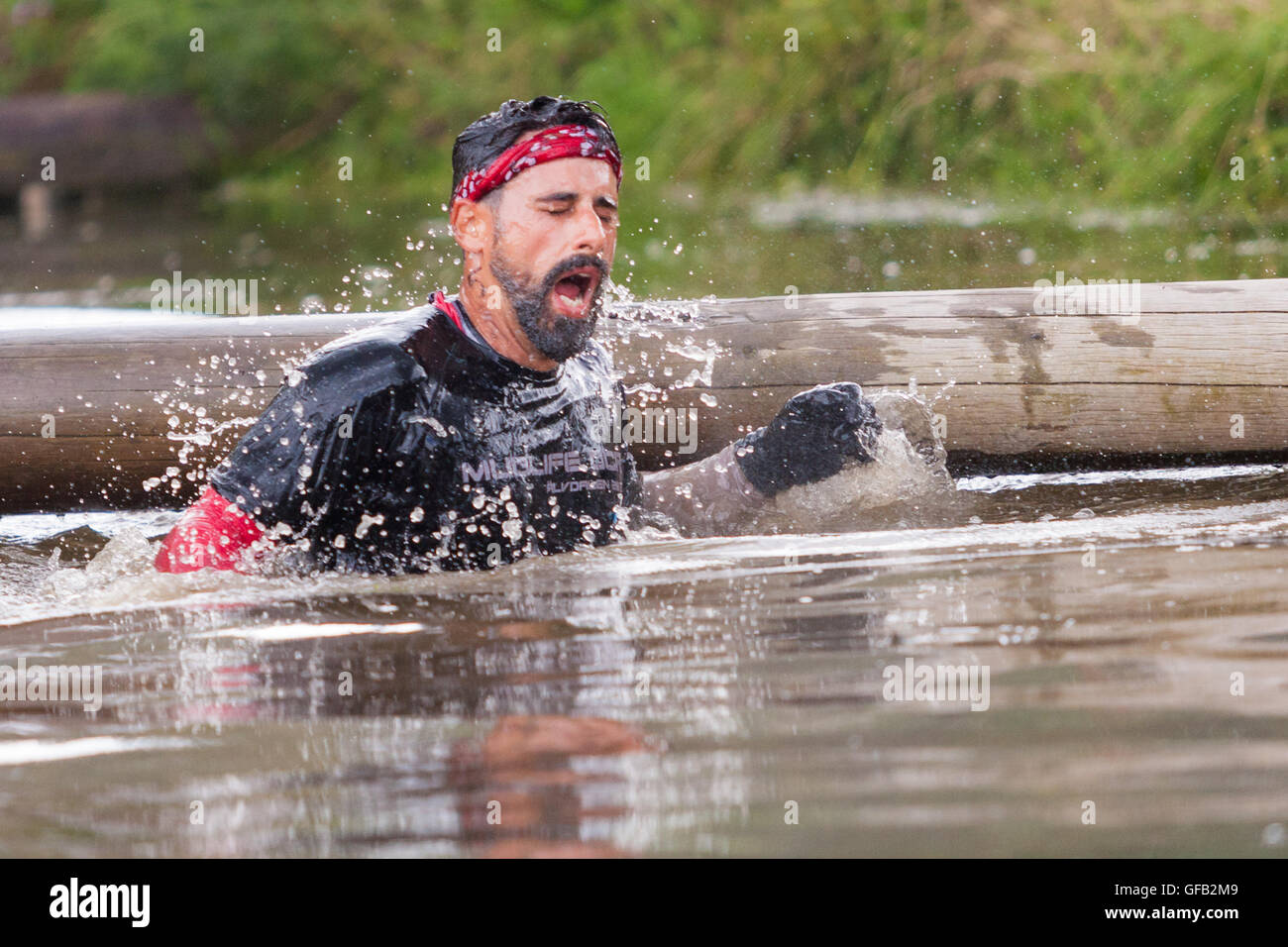 Tough Guy Nettle Warrior 2016 competitor, near Wolverhampton UK at the annual summer obstacle course Stock Photo