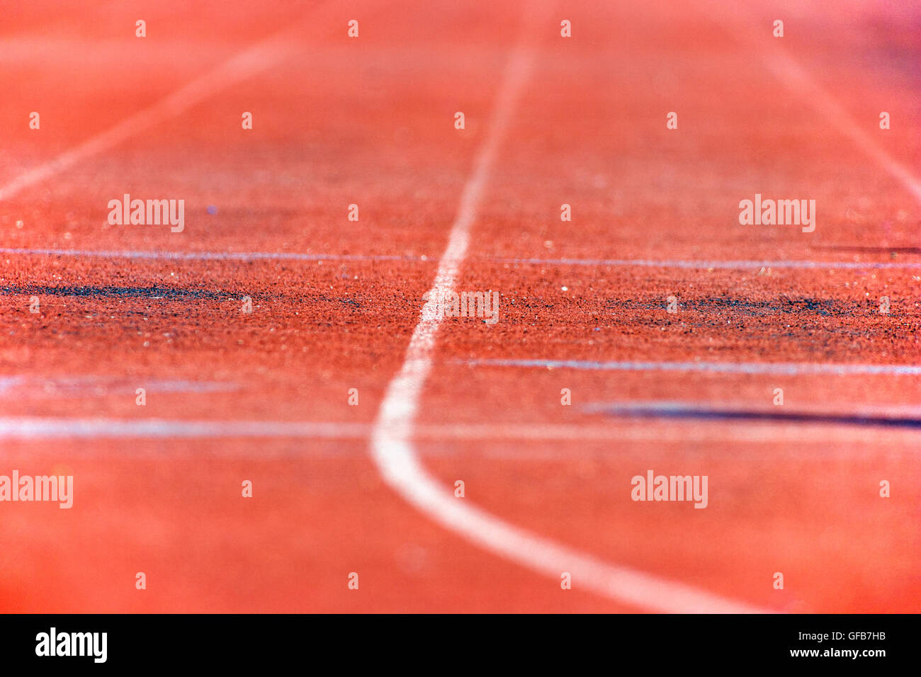 Close up of the synthetic track surface at a high school track & field meet Stock Photo