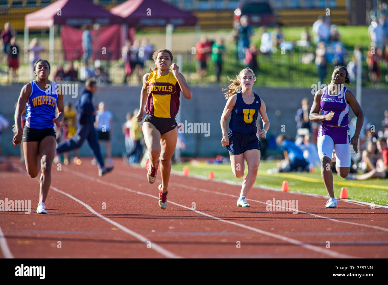 Female high school students compete at the Henderson Invitational Track & Field Meet Stock Photo