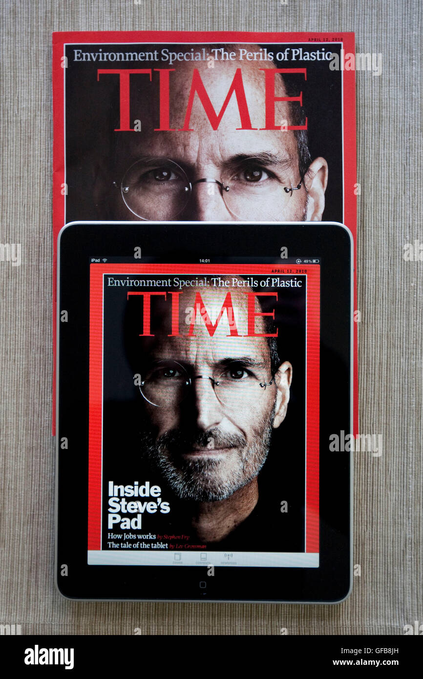 Apple iPad displaying the Time Magazine application on a print version of the magazine with Steve Jobs on the cover, 2010. Stock Photo