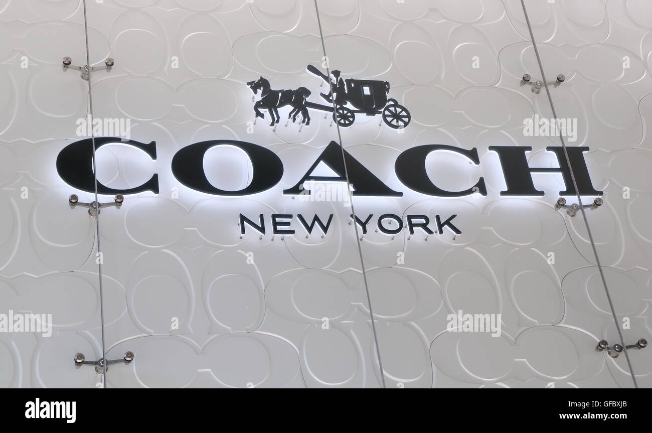 Cellphone with logo of US luxury fashion company Tapestry Inc. on screen in  front of Coach New York website. Focus on center-left of phone display  Stock Photo - Alamy
