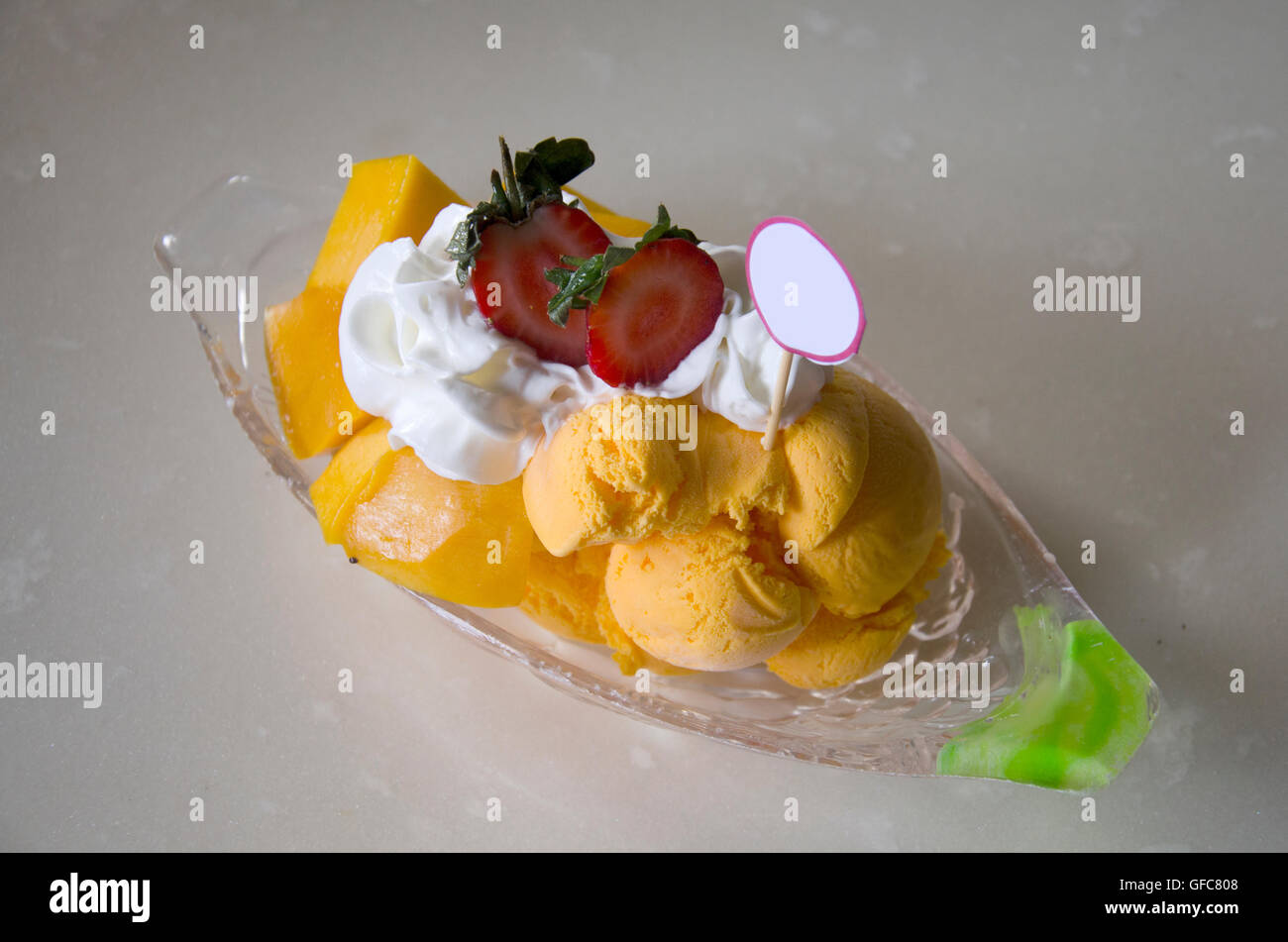 Mango Cheese Bingsoo or Shaved ice fruit and wipcream at restaurant in Malaysia Stock Photo
