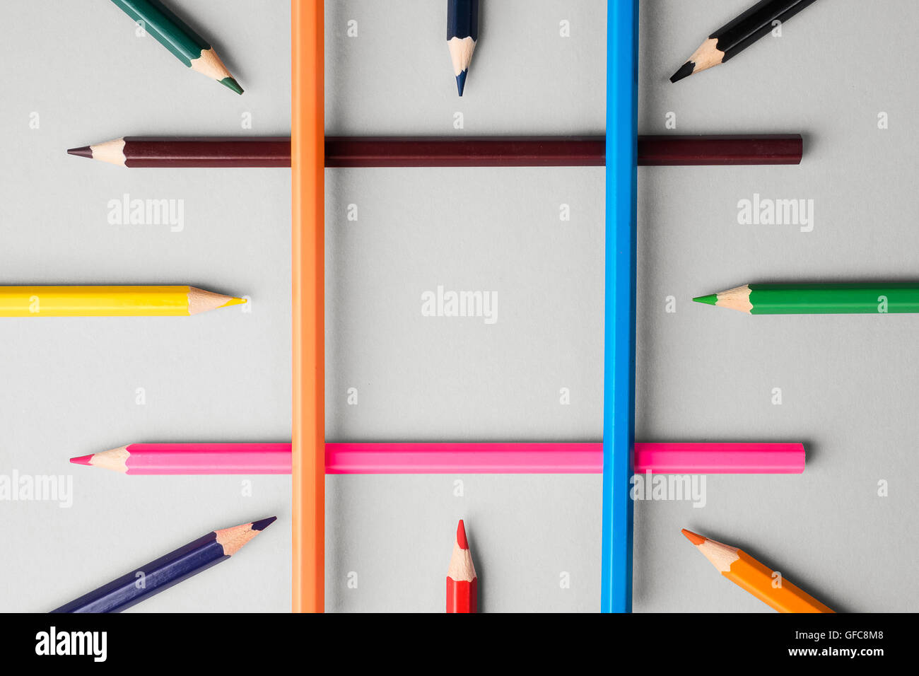 Collection of colorful crayons over white background, above view Stock Photo