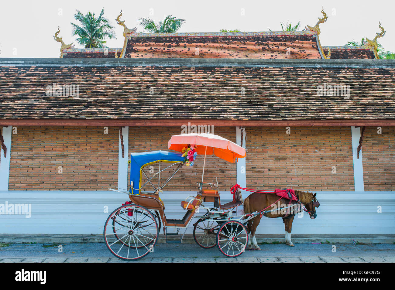 Traditional Horse Carriage ride in Wat Phra That Lampang Luang Stock Photo