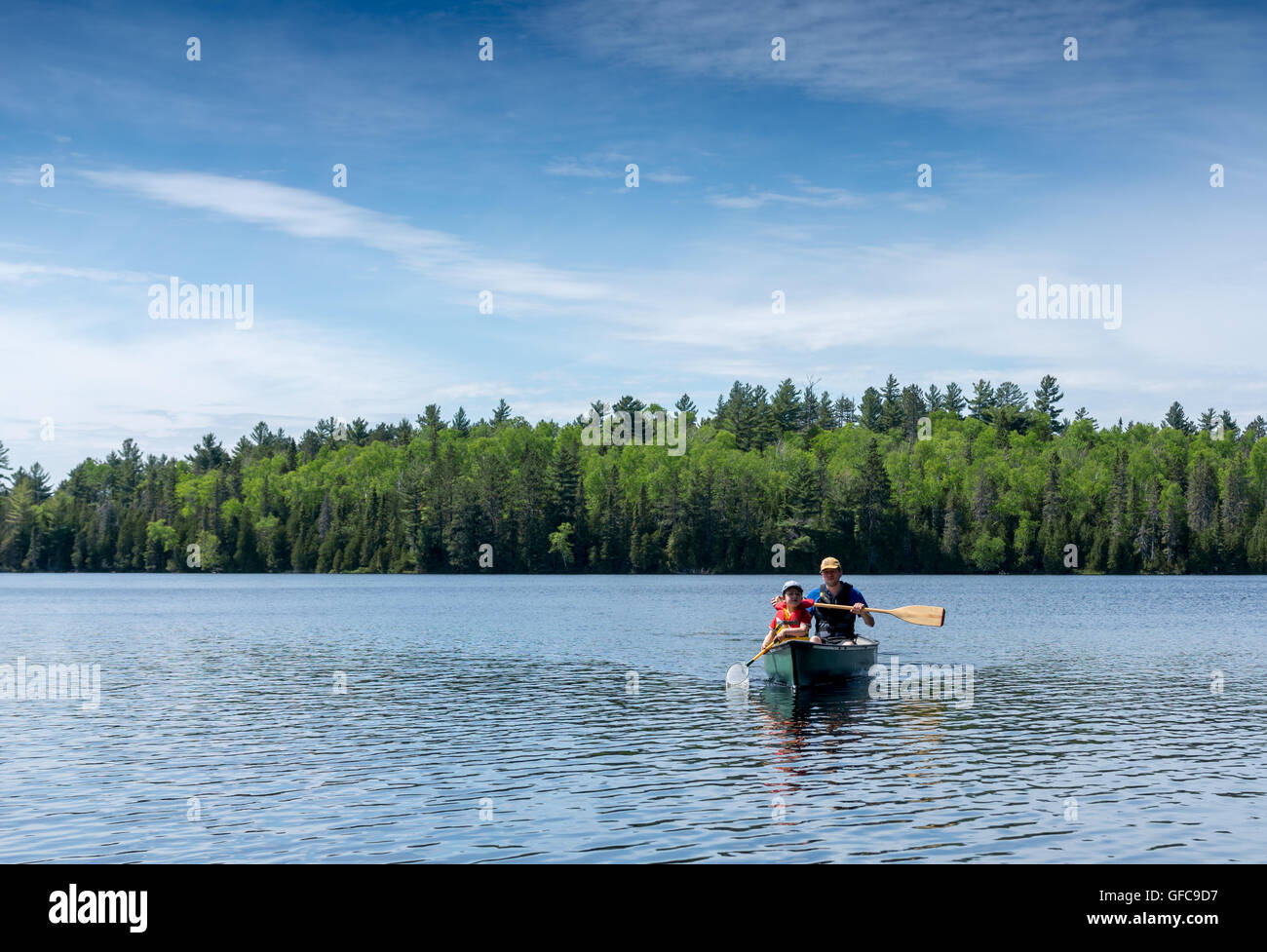 contryside ontario canada nature father and son canoe fishing Stock