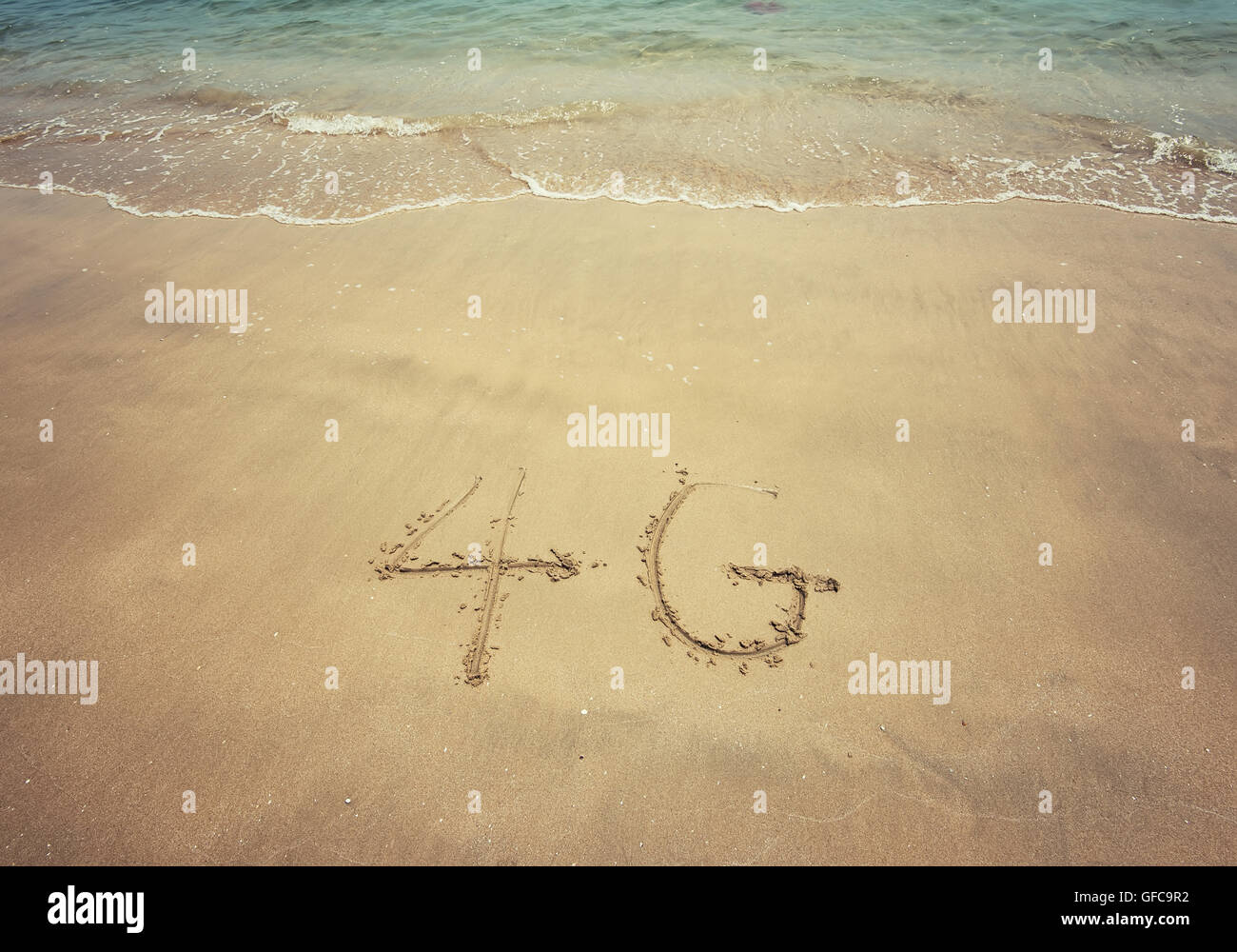 4g written in the sand Stock Photo