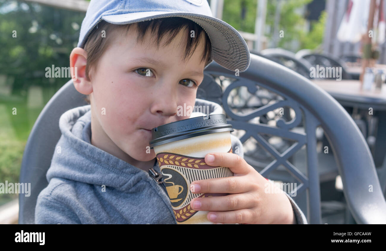 kid boy pretends to drink coffee Stock Photo Alamy