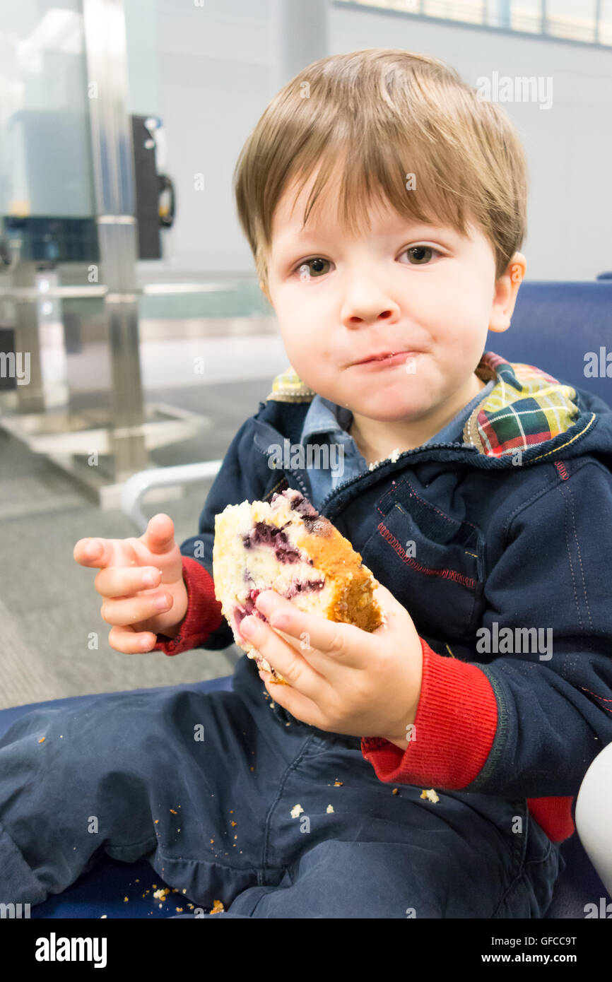 Portrait boy eating sweet bun hi-res stock photography and images - Alamy