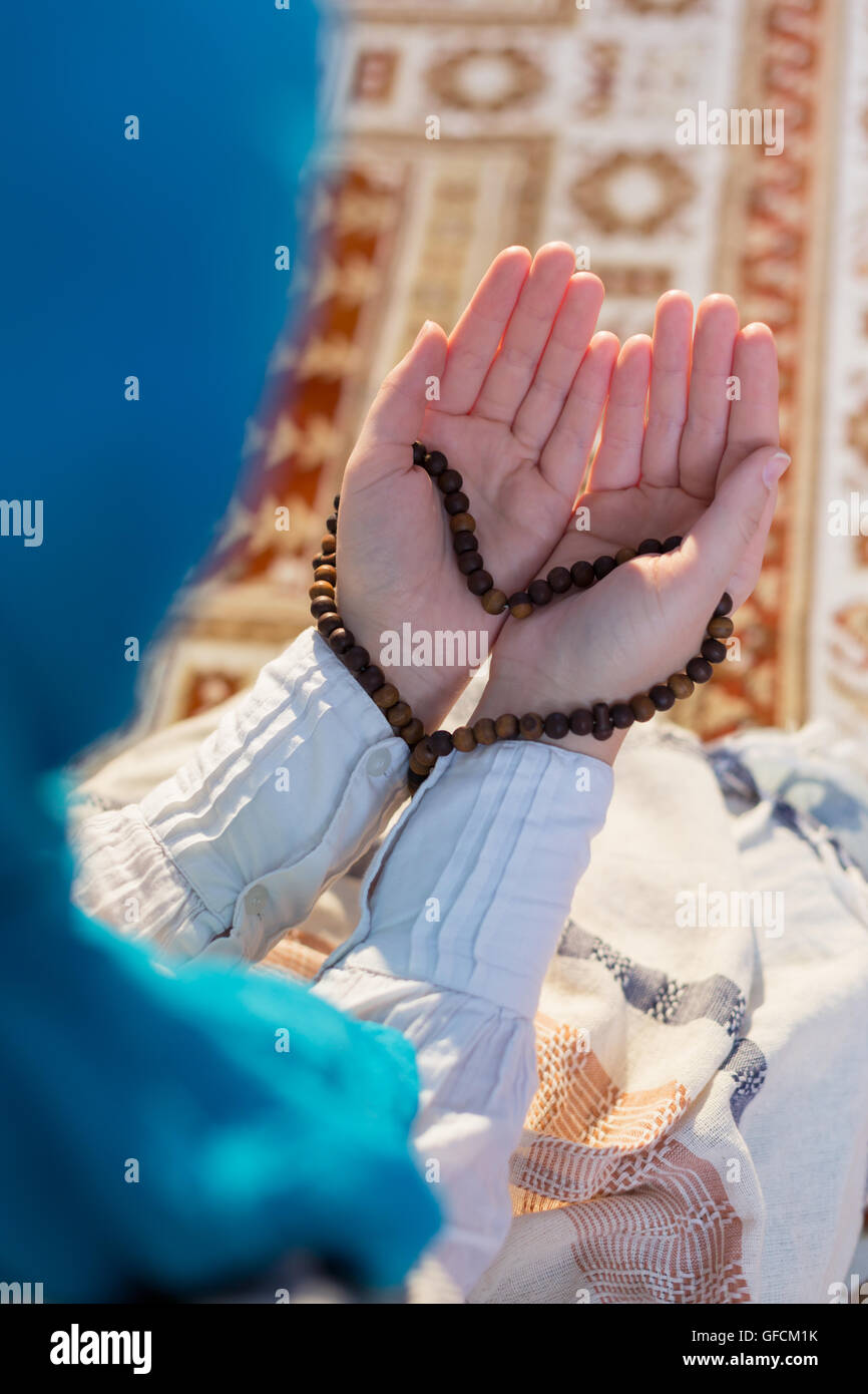 young muslim woman praying for Allah, muslim God Stock Photo - Alamy