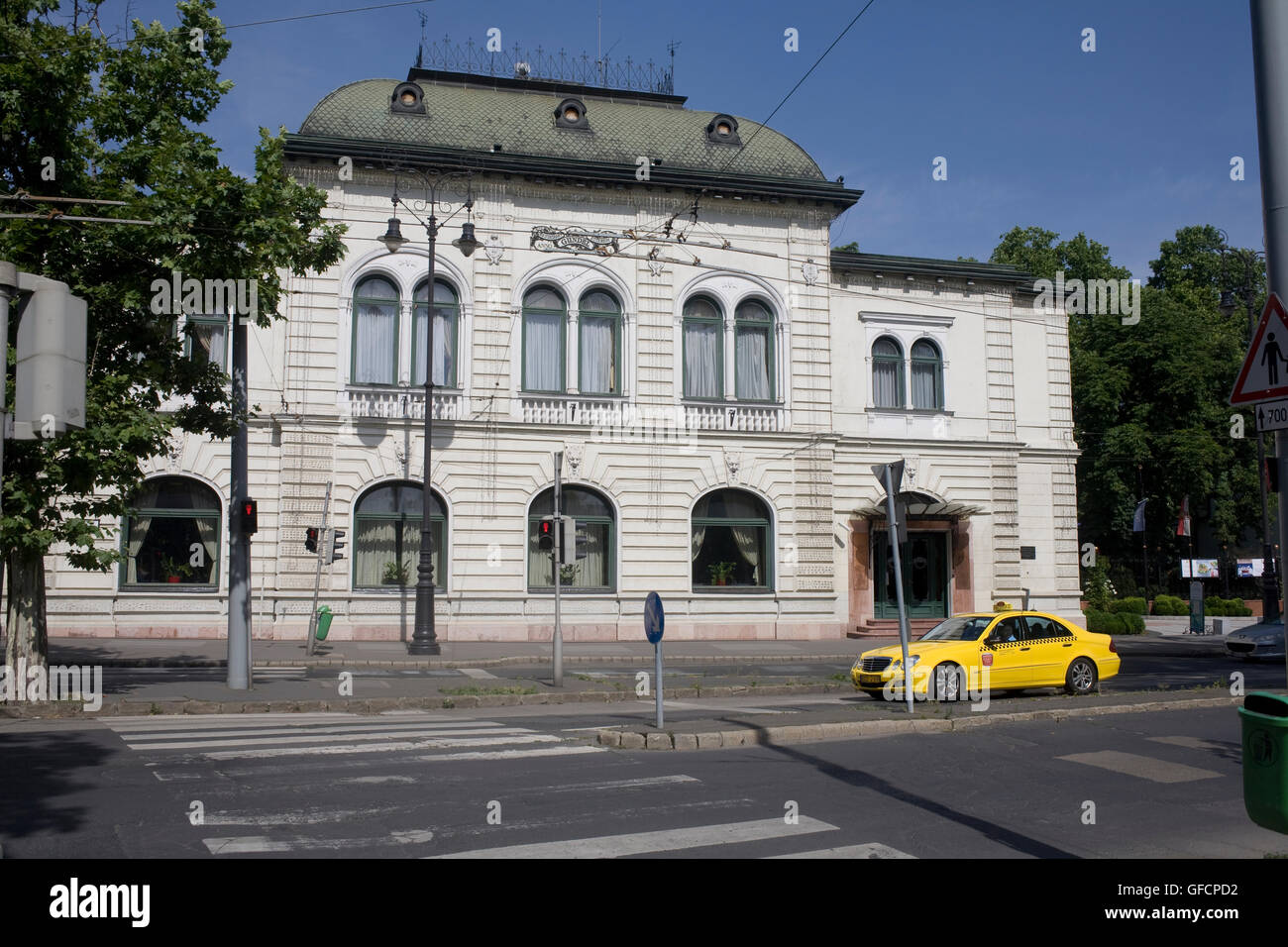 Gundel restaurant on Károly út in City park with pedestrian crossing and taxi outside Stock Photo