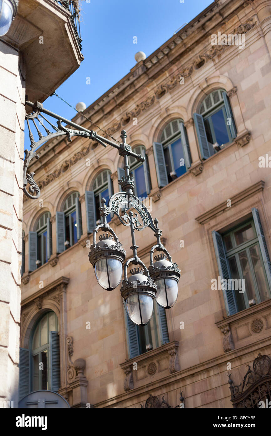 Street light hanging mounted on wall, Barcelona, Catalonia, Spaincolor