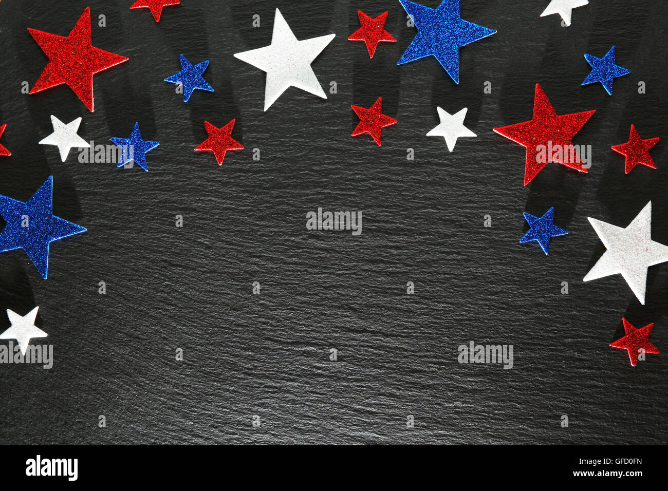 Red, white, and blue stars on slate background Stock Photo