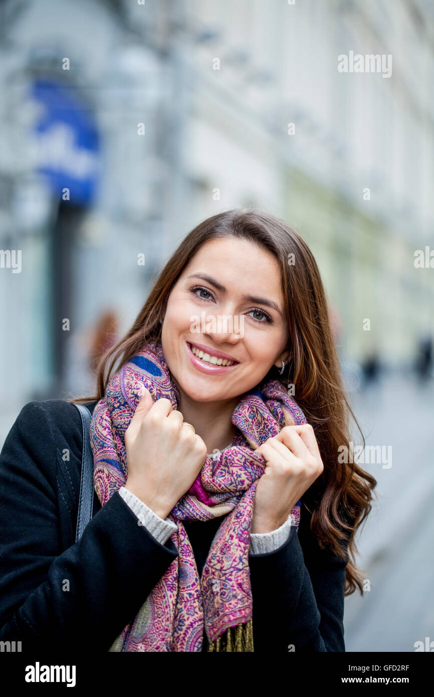 Portrait of young happy woman in red scarf Stock Photo