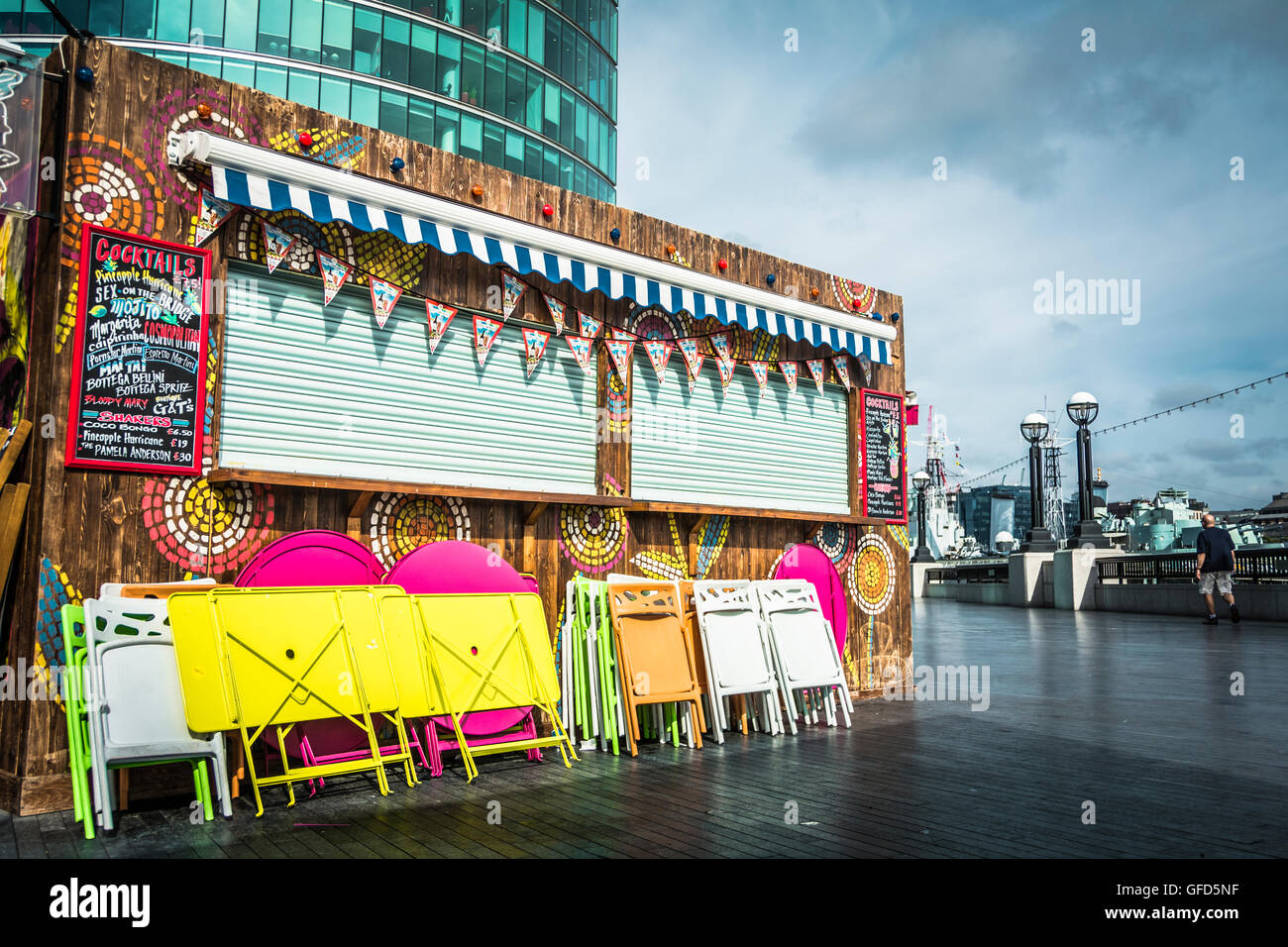 A brightly coloured cocktail bar next to the river Thames on The Queen's Walk, London SE1. Stock Photo