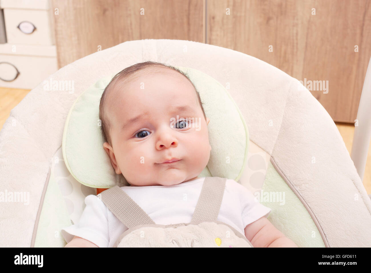 Baby in his swing Stock Photo Alamy