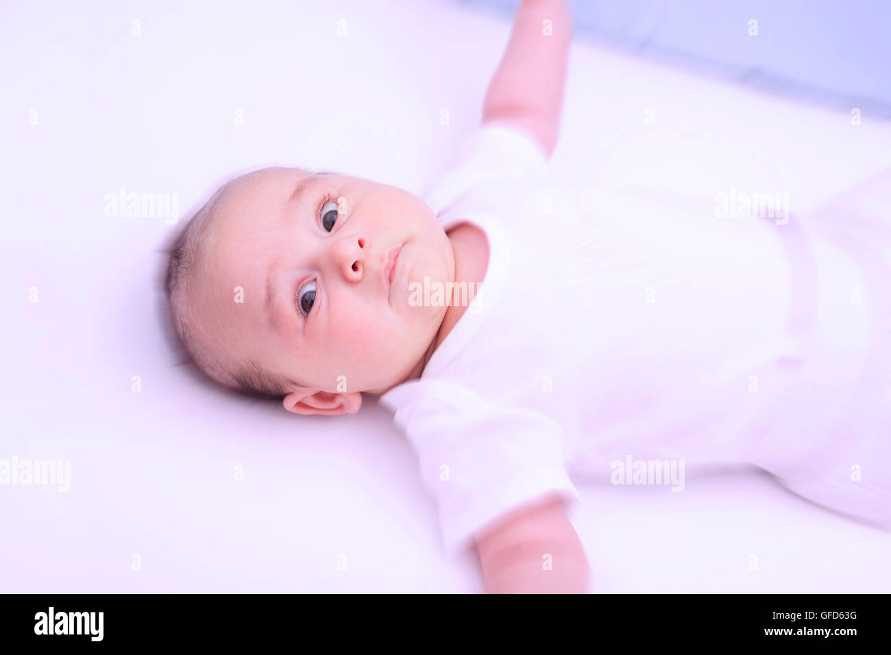 Scared crying baby in his crib Stock Photo Alamy