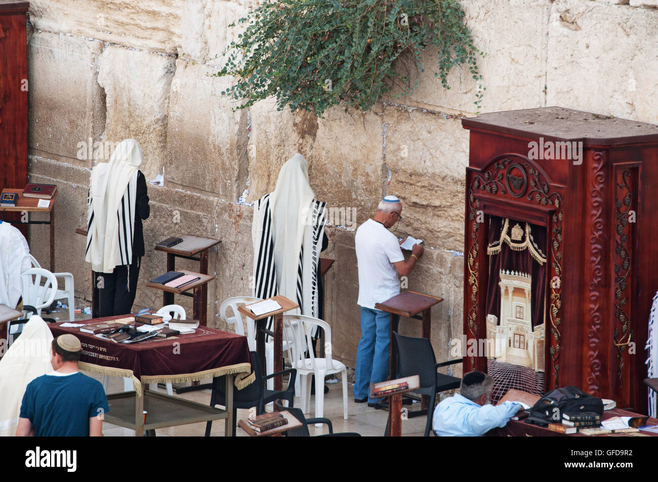 Jerusalem: Jewish men praying at the Western Wall, the Wailing Wall or Kotel, surviving remnant of the Temple Mount, the holiest place for Hebraism Stock Photo