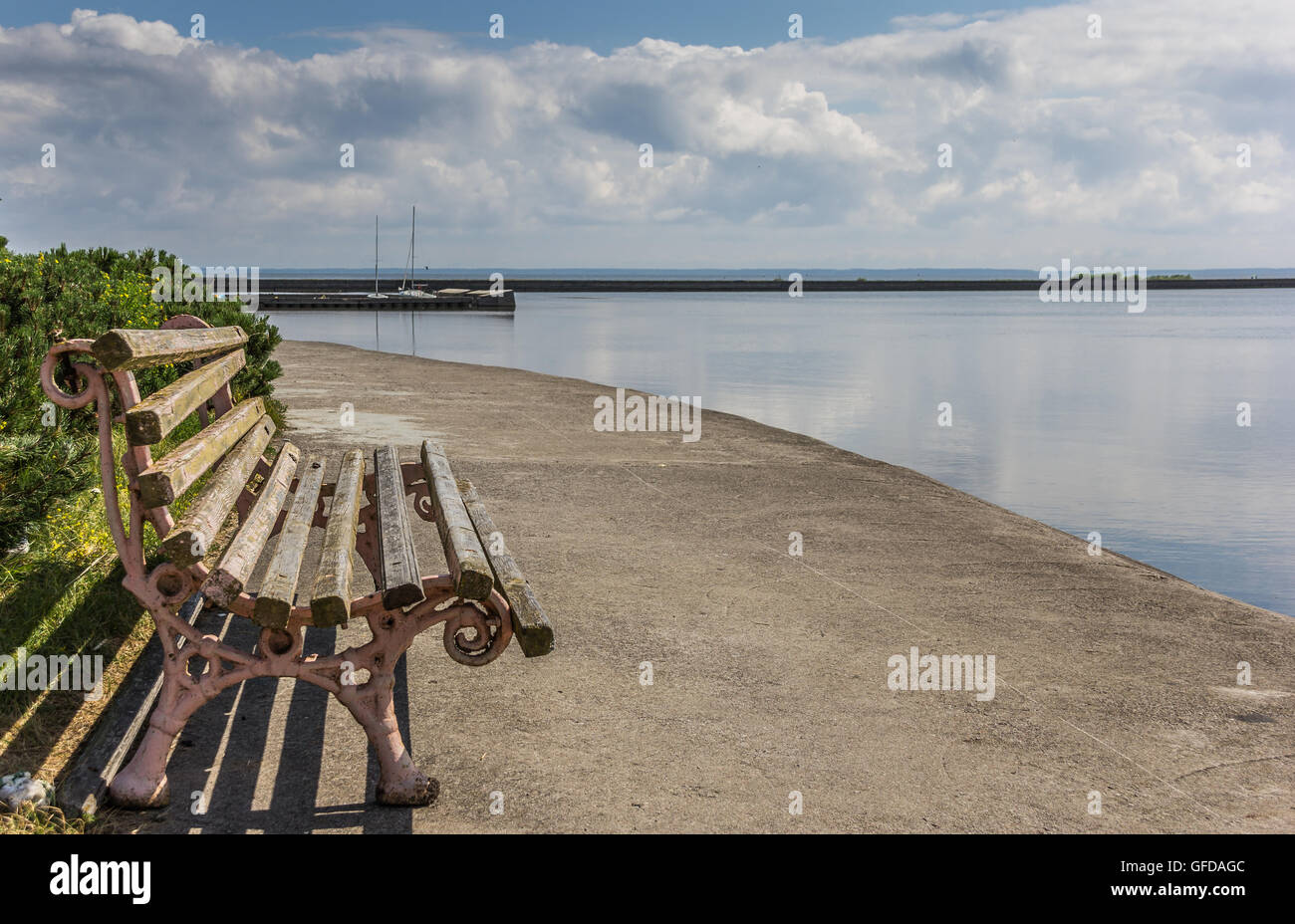 Bench at the quay on the peninsula of Curonian Spit, Lithuania Stock Photo