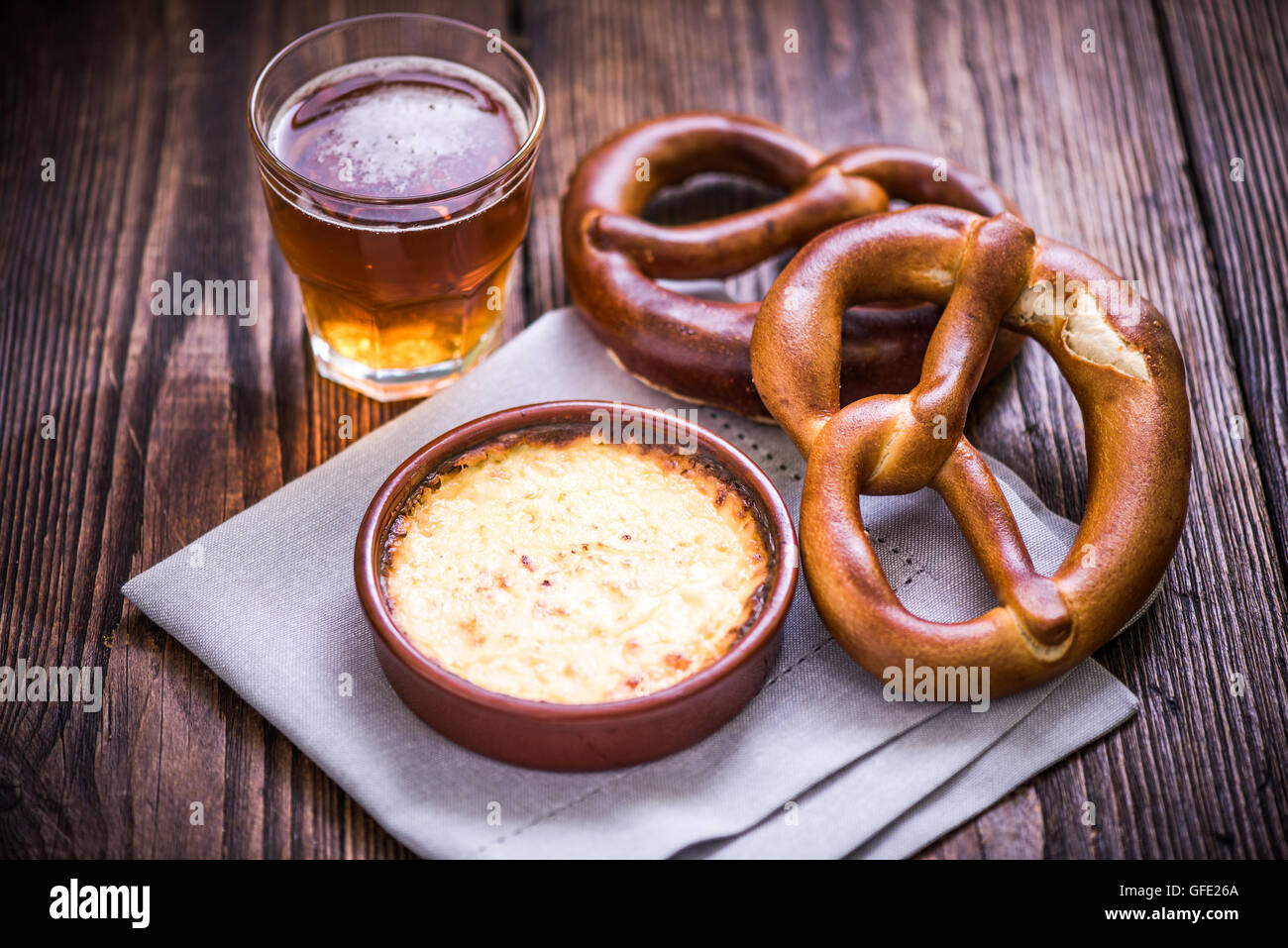 Hot cheese fondue with pretzel and beer Stock Photo Alamy