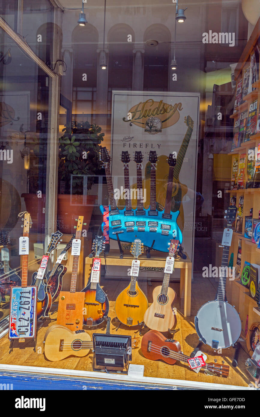 Colourful guitar display in the window of Cranes music shop, Cardiff