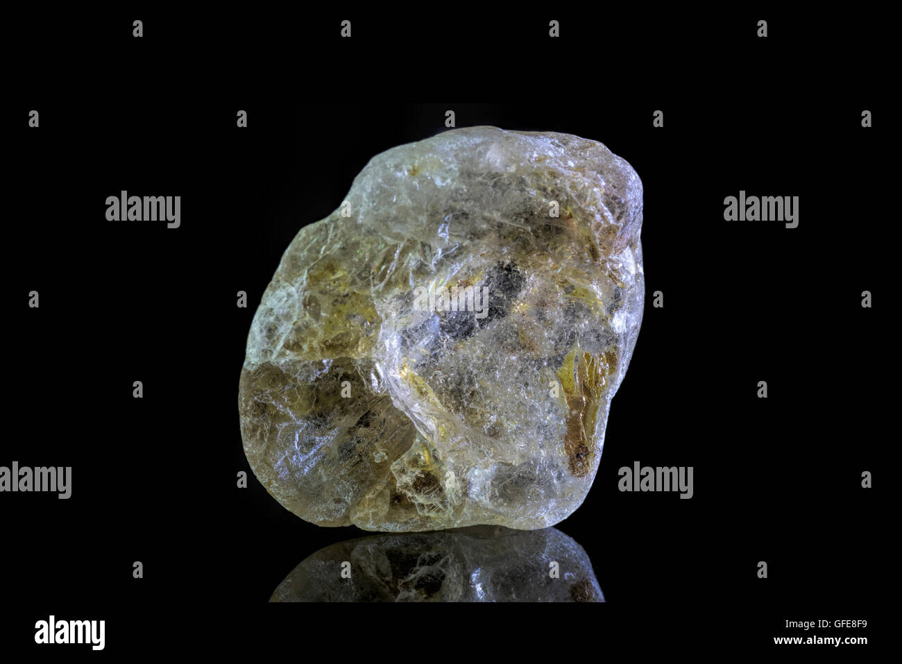 Sample of a beautiful natural raw Topaz specimen over black background