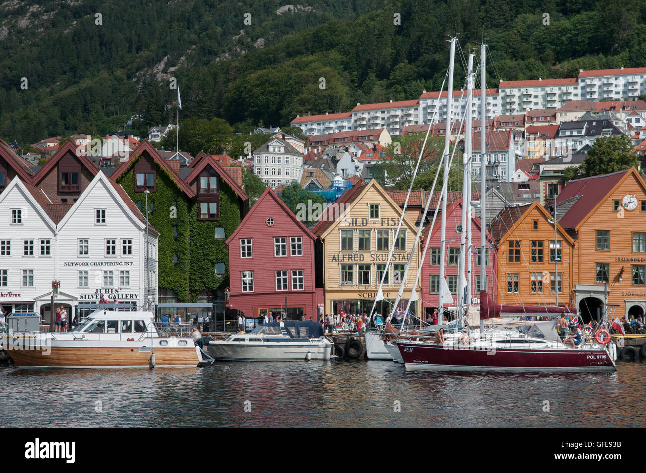 Bergen, Norway. The Bryggen district in Bergen with boats lining the harbour side. Stock Photo