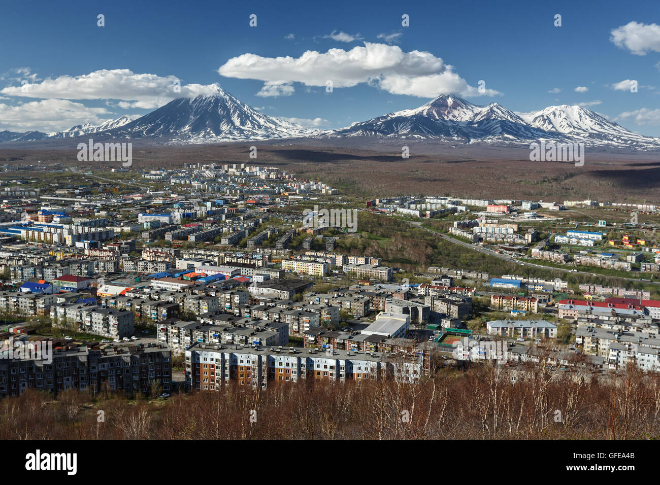 Panoramic view of the Petropavlovsk-Kamchatsky City and volcanoes: Koryaksky Volcano, Avacha Volcano, Kozelsky Volcano. Far East Stock Photo