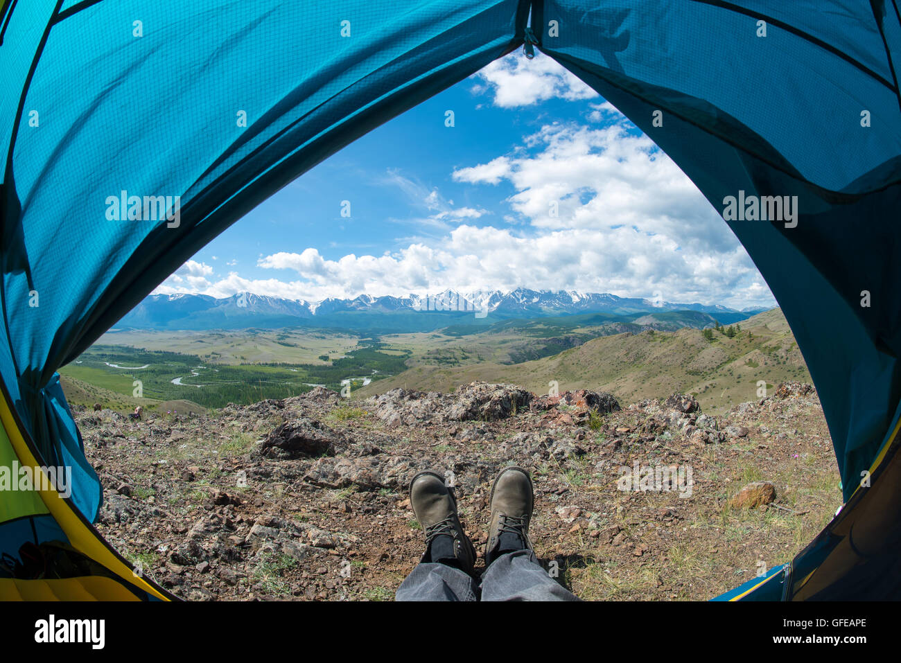 feet in the shoes against the backdrop of the mountains Stock Photo Alamy